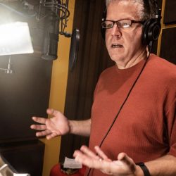 Man in ISO Booth in intense thought