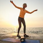 balancing lady on beach